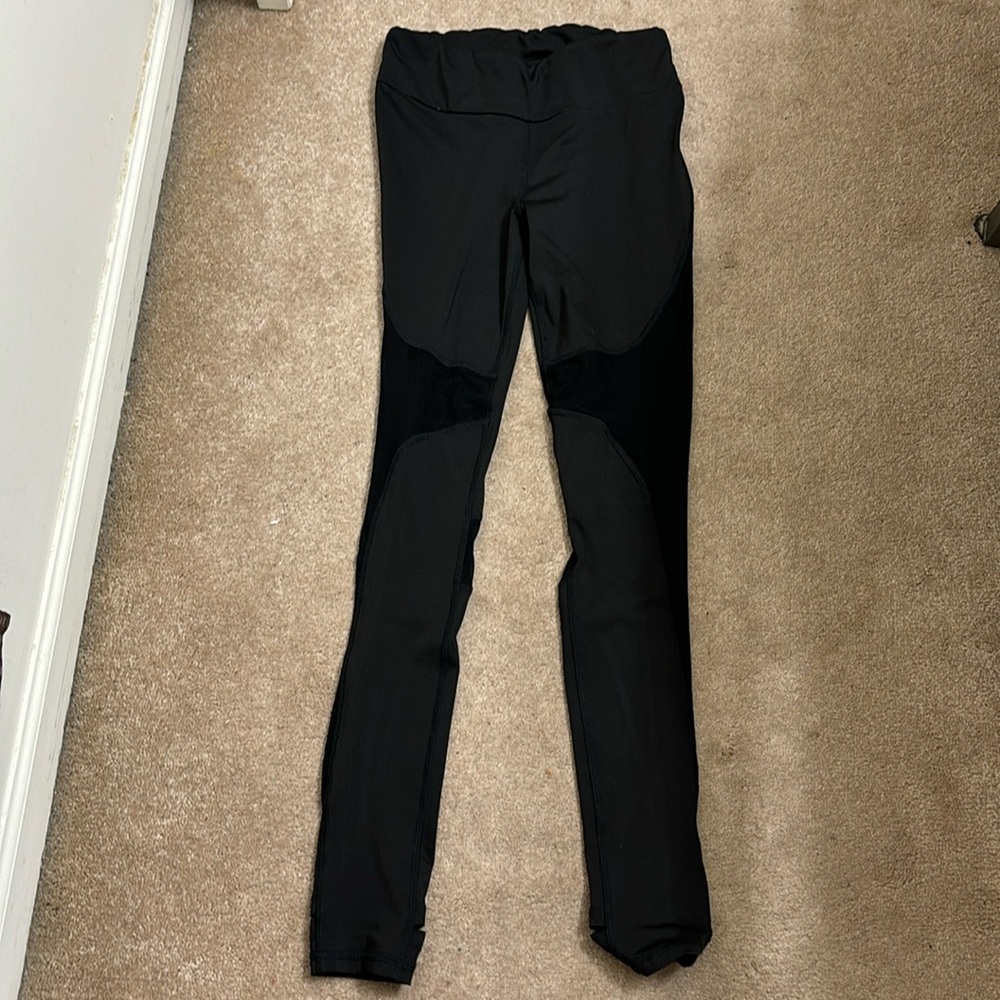 Women’s black leggings with see through patches and cut out heel/bottom size M